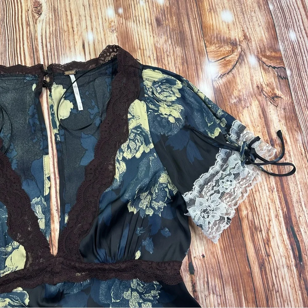 Free People Printed Mini Dress - Black Combo
Size Small - Picture 12 of 15